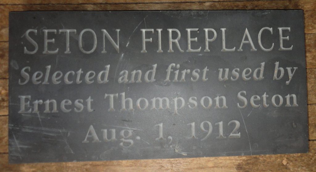 Plaque on Black Wolf Chair Seton Fireplace