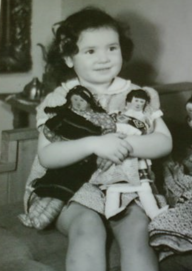 Beulah Seton holding two dolls in black and white photo